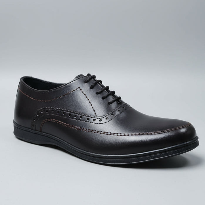 Brown leather shoes on a wooden surface with blurred background