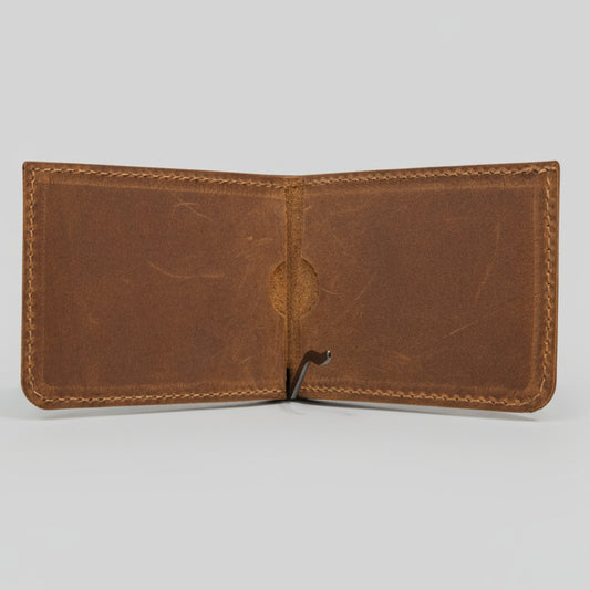 Brown leather wallet open on a light gray background