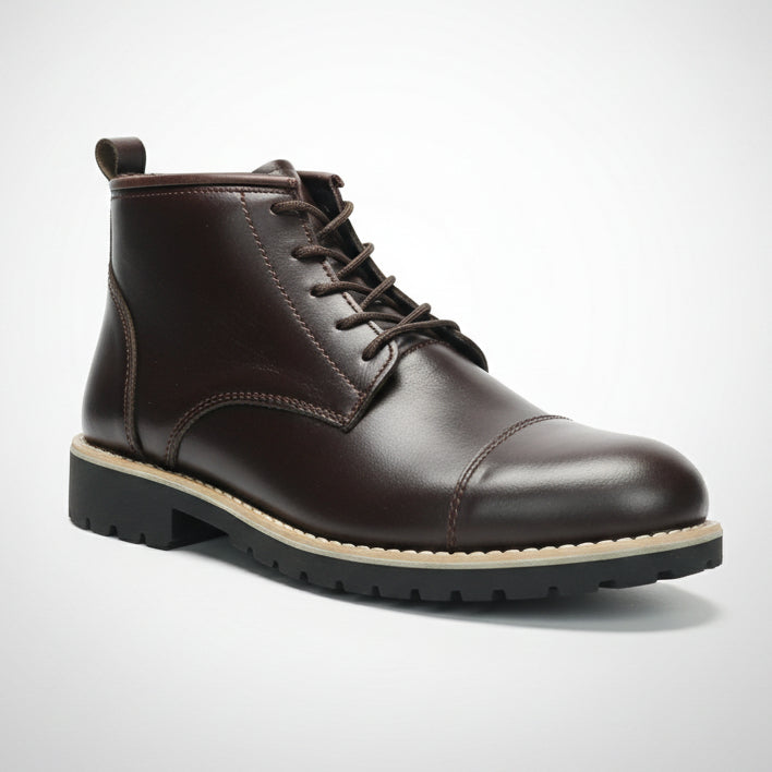 Brown leather boot held in front of a shoe rack with various shoes.