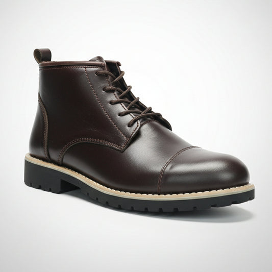 Brown leather boot held in front of a shoe rack with various shoes.