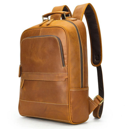 Brown leather backpack on a white background
