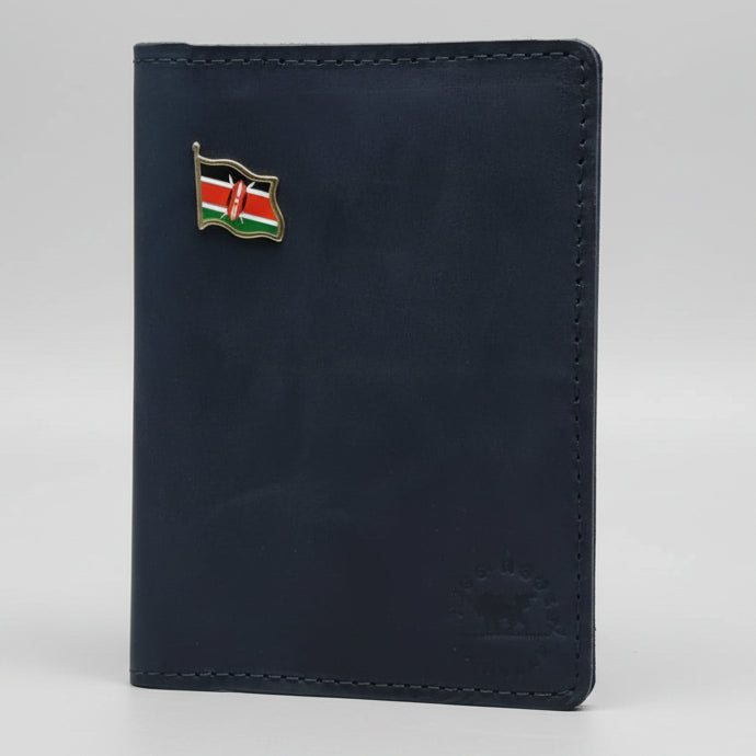 Blue leather wallet with a flag pin on a wooden surface