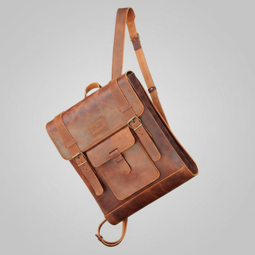 Brown leather backpack on a light gray background