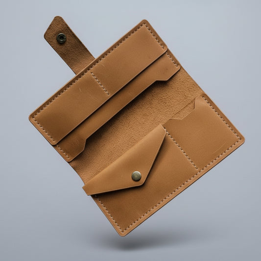 Brown leather wallet on a gray background
