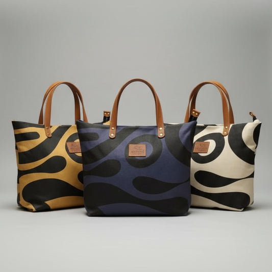 Three patterned bags on a wooden surface with a blurred background