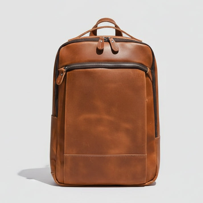 Brown leather backpack on a light gray background
