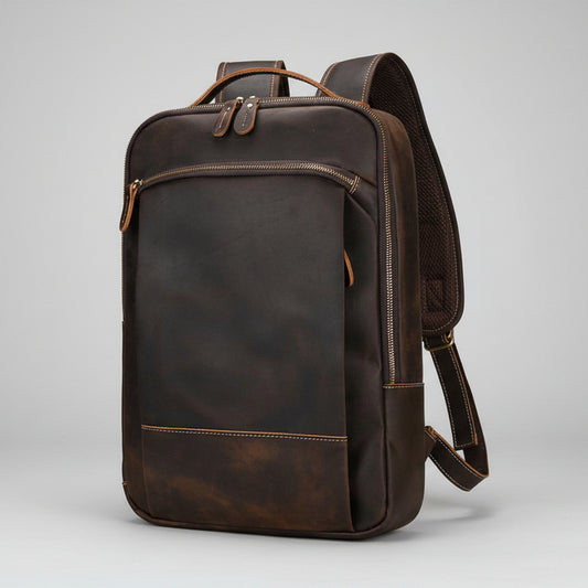 Brown leather backpack on a light gray background