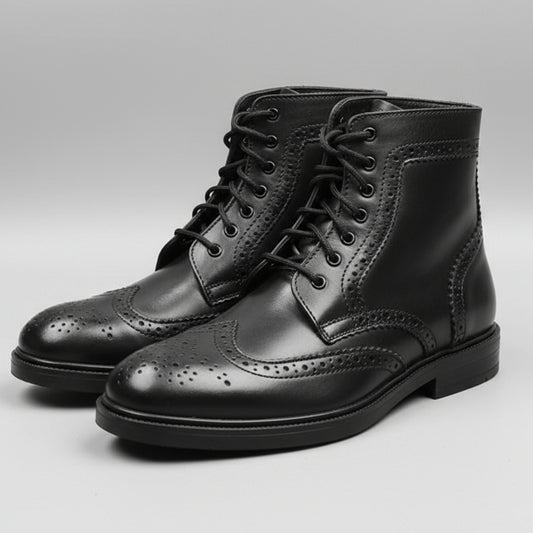 Person holding a pair of black leather boots in front of a shoe rack.