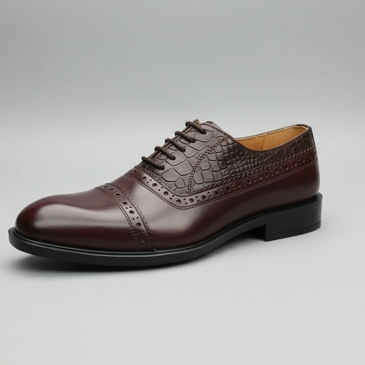 Brown leather shoe held in front of a shoe rack with various shoes displayed.